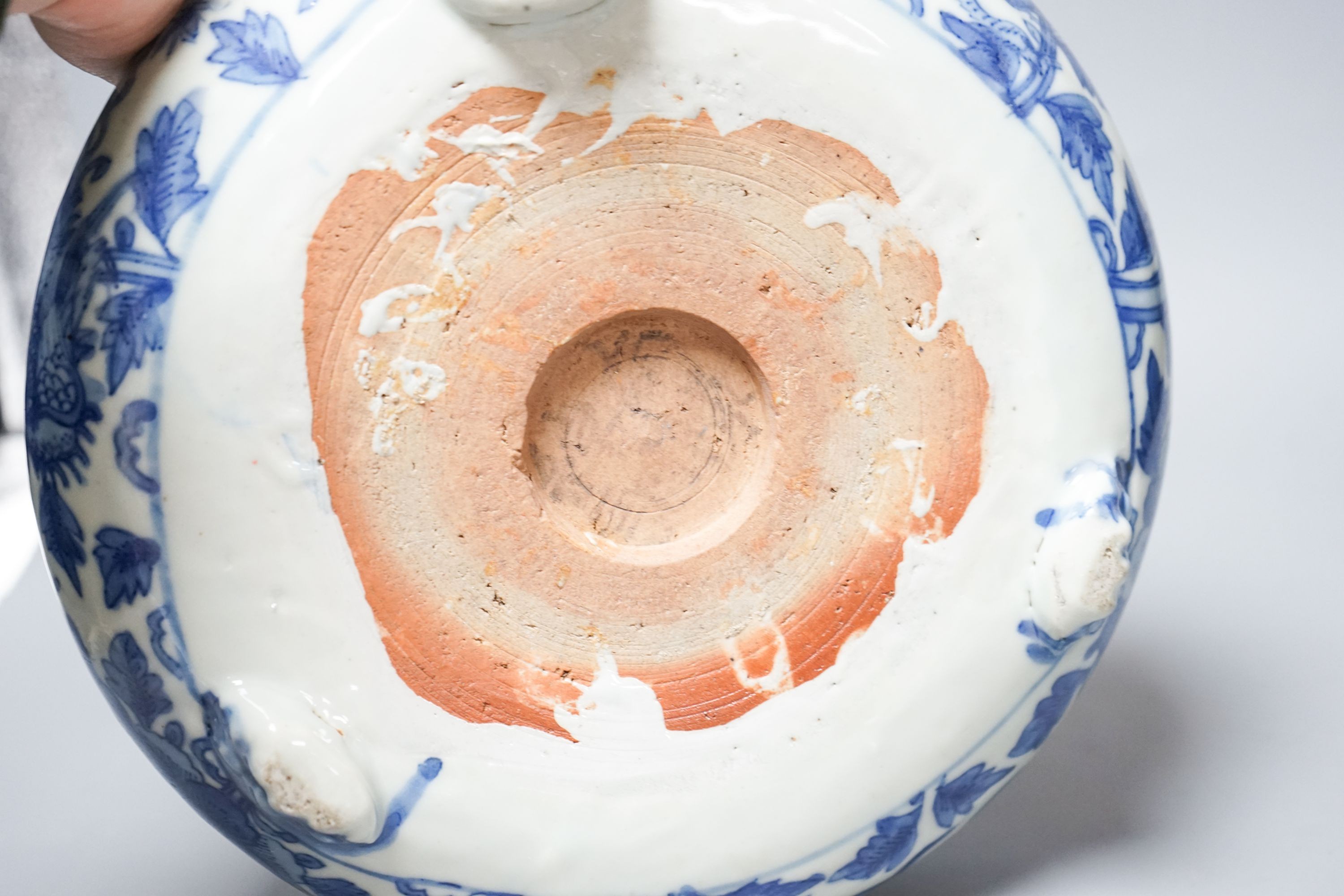 A 19th century Chinese circular blue and white censer, with phoenix and peony decoration, on three lion's paw feet 26cm
